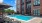 Resort-style swimming pool with lounge seating
