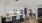 a living room next to a kitchen