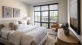 Bedroom with natural lighting and high ceilings