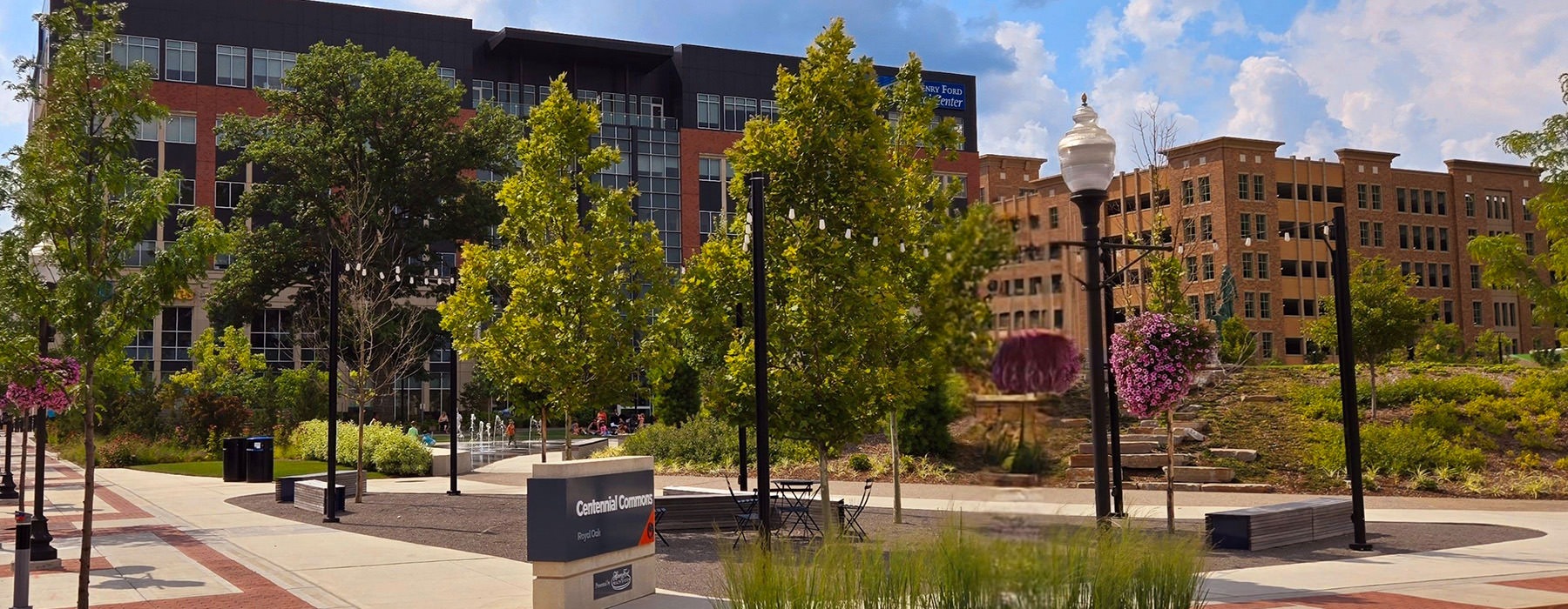 walkways with trees and a large building